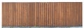 Solid wooden fence from brown vertical boards