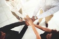 Solidarity leads to success. Closeup shot of a group of businesspeople joining their hands together in a huddle. Royalty Free Stock Photo