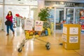 Solidarity shopping, a cart for grocery store customers to donate goods for poor people.Garbage bin for face masks