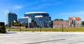 Solidarnosci square with surrounding office buildings and tenement houses in old Gdansk Shipyard quarter in front of European Royalty Free Stock Photo