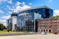 Solidarnosci square with surrounding office buildings and tenement houses in old Gdansk Shipyard quarter in front of European Royalty Free Stock Photo