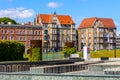 Solidarnosci square and surrounding tenement houses in old Gdansk Shipyard quarter in front of European Solidarity Centre in Royalty Free Stock Photo