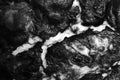 Solidified hot white lava texture of eruption volcano in black and white Royalty Free Stock Photo