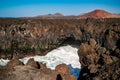 Solidified lava cliffs and caves at Los Hervideros, Lanzarote, Spain.