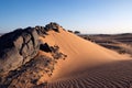 Solidified Lava Stones In Sand Dune Royalty Free Stock Photo