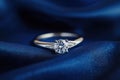 Solitaire diamond engagement ring on satin Royalty Free Stock Photo