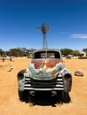 Abandoned old rusty car. Body of a retro car in the sands. Desert in Namibia. Royalty Free Stock Photo