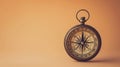 A solitary antique compass, isolated against a clean smooth single color backdrop