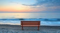 A Solitary Bench Facing the Sea at Sunrise Royalty Free Stock Photo