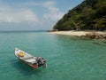 Solitary boat in emerald waters, Pulau Kapas Island Royalty Free Stock Photo