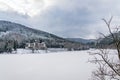 Solitary building in beautiful snowy winter forest landscape, frozen Brezova dam Royalty Free Stock Photo