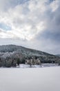 Solitary building in beautiful snowy winter forest landscape, frozen Brezova dam Royalty Free Stock Photo