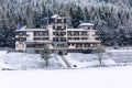 Solitary building in beautiful snowy winter forest landscape, frozen Brezova dam Royalty Free Stock Photo