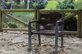 Solitary chair in the park close to the lake in autumn