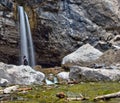 A solitary figure rests next to Spouting Rock in Glenwood Canyon, Colorado