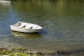 Solitary fishing boat floating on the river