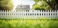 Solitary Flower Along White Picket Fence Royalty Free Stock Photo