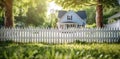 Solitary Flower Along White Picket Fence Royalty Free Stock Photo