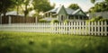 Solitary Flower Along White Picket Fence Royalty Free Stock Photo