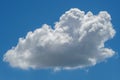 Solitary fluffy cumulus cloud suspended in a clear blue sky Royalty Free Stock Photo