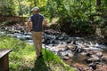 Solitary man contemplates nature on woodland hike