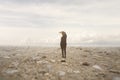 Solitary man looks at the infinite in a surreal and spectacular landscape