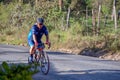 A solitary man rides his bike Royalty Free Stock Photo