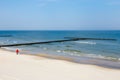 Solitary man walking on the beach Royalty Free Stock Photo