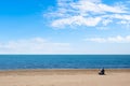 Solitary man watching the sea during a beautiful winter day Royalty Free Stock Photo