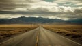 Solitary Passage: A Desolate Road Cutting Through an Unforgiving Landscape Royalty Free Stock Photo