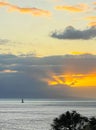 Solitary sailor at sunset off the Maui coast