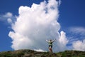 Solitary smiling girl holds in hands a cloud in mountains of Altai