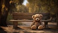 a solitary teddy bear seated on a weathered park table,