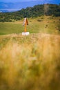 Solitary traditional cross symbol on a meadow on a hill