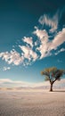 Solitary tree stands resilient in vast desert expanse, captivating solitude Royalty Free Stock Photo