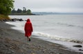 Solitary walk along a pebbled shore Royalty Free Stock Photo