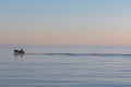 Solitude. Alone at sea. Small fishing boat on the ocean