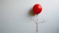 Solitude in Flight: A Single Red Balloon Drifts Aimlessly Against a Blank Canvas