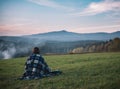 Solitude woman and amazing sunset landscape. One woman at beautiful scenery.