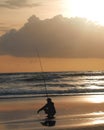 Solo angler fishing at sunset