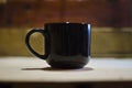 Solo blank black coffee mug on a table