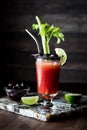 A solo Caesar cocktail garnished with black olives, celery and lime. Royalty Free Stock Photo