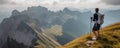 Solo hiker admiring the view on top of a mountain. French Alps view of the Col des Aravis - tourism and vacation - Pointe de