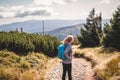 Solo hiker walking on trekking trail in mountains