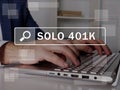 SOLO 401K text in search bar. Businessman looking for something at laptop. SOLO 401K concept