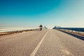 Solo motorbiker driving on an empty road single man trip with his motorbike Royalty Free Stock Photo