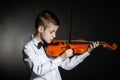 Solo musician holds violin under his chin