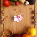 Orchid in the middle of vegetables and fruits