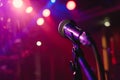 Solo Spotlight: Empty Stage with Focused Microphone Glow. Royalty Free Stock Photo