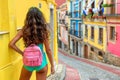 Solo traveler explores historic streets in spain s old town, backpacking adventure